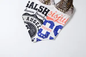 Detailed macro view of stylish women's halter top featuring leopard and letter prints