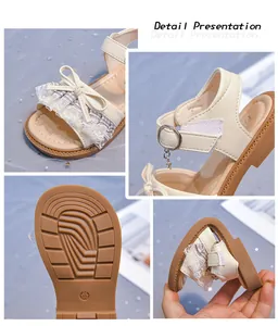 Detailed view of girls' cream lace bow sandals featuring soft non-slip soles and adjustable straps