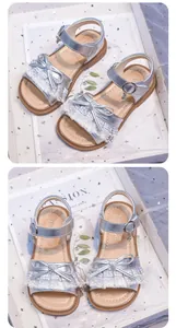 Elegant silver girls princess sandals featuring a lace bow and soft sole detail