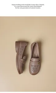 Close-up of women's breathable hollow-out loafers with elegant geometric cutouts.