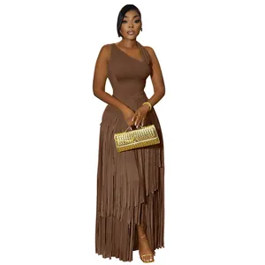 Detail of elegant brown one-shoulder evening dress featuring long layered fringe