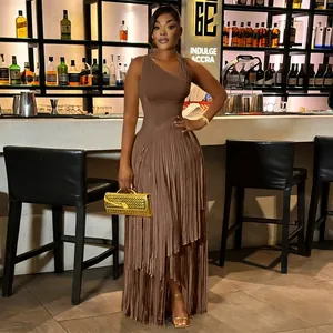 Elegant brown sleeveless fringe tassel evening gown for women in a sophisticated bar lounge.