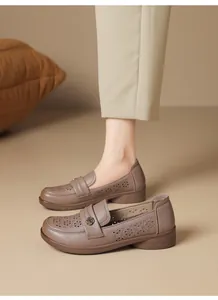 Elegant brown breathable hollow-out loafers with soft soles and floral metal buckle detail