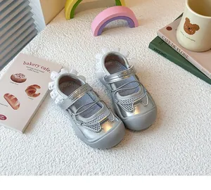 Detailed view of silver girls ballet style sports sandals with mesh and lace accent