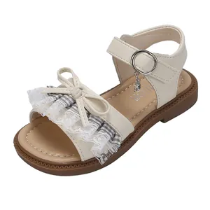 Elegant beige girls' princess sandals featuring white lace ruffles and sweet bow