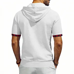 Back view of men's white waffle knit hooded t-shirt with red plaid cuffs.
