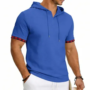 Close-up detail of men's blue hooded sporty t-shirt featuring plaid sleeve trim and drawstrings
