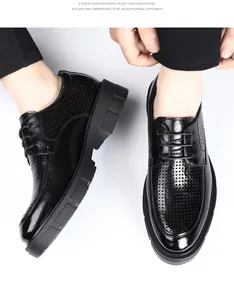 Close-up detail of black men's breathable hollow business dress shoes with thick soles