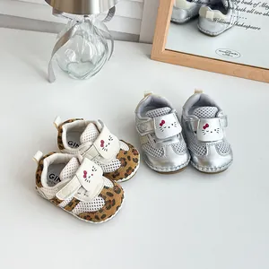 Close-up of summer baby mesh shoes with soft soles and cute cat face details