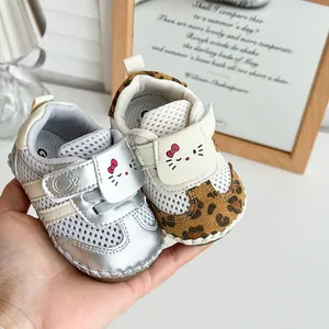Detailed close-up of summer baby mesh pre-walker shoes with soft soles and cute cat design