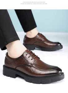 Detailed view of men's brown breathable perforated leather dress shoes with lace-up