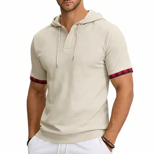 Detail view of men's beige hooded T-shirt with plaid cuffs and textured breathable fabric