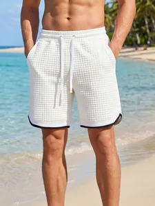 Close-up of white checkered waffle texture men's shorts with contrast hem
