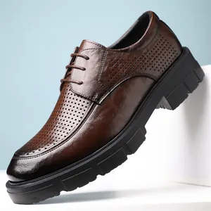 Men's stylish brown perforated leather dress shoes with thick soles and lace-up design