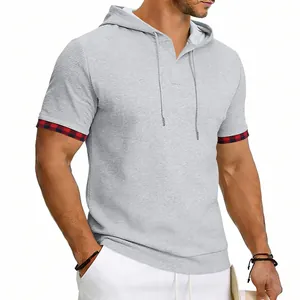 Detail view of men's gray waffle knit hooded T-shirt featuring plaid cuff trim and drawstrings