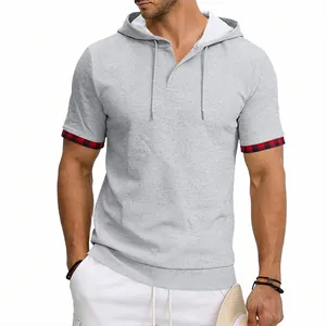 Detailed view of a grey hooded t-shirt for men with stylish red plaid cuffs and drawstrings