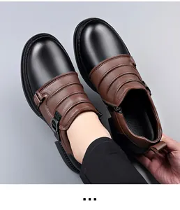 Close-up of men's two-tone leather Martin boots with side zipper detail