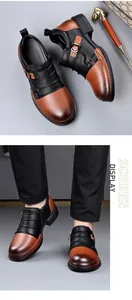 Detailed view of men's vintage leather Chelsea boots with side zipper and two-tone design