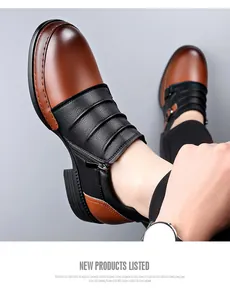 Detailed view of men's vintage brown and black Martin boots with side zipper and pleated leather