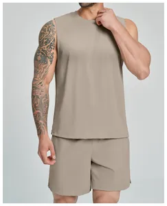 Detailed view of men's tan athletic sleeveless tank top and matching gym shorts set
