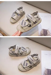 Detail view of breathable grey boys' sport sandals with adjustable velcro straps.