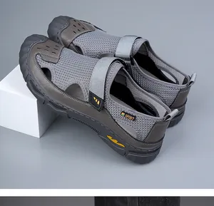 Detail view of breathable grey mesh men's outdoor sandals with secure Velcro strap