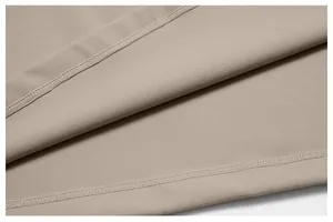Close-up of khaki sports vest fabric showing high-quality durable stitching and texture.