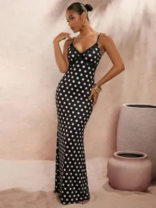 Elegant long black polka dot slip dress featuring a lace-trimmed V-neckline and slender straps
