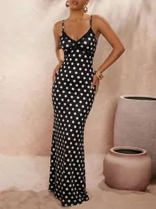Elegant floor-length black and white polka dot maxi dress with delicate lace V-neck detail