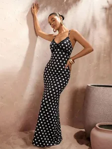 Detail of classic black and white polka dot slip maxi dress with lace V-neck