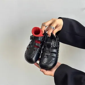 Vintage black hollowed-out Roman leather shoes for children with adjustable buckle strap