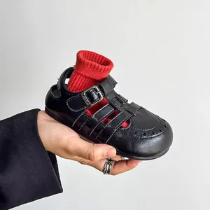 Classic children's retro hollow Roman leather sandals in black with breathable closed toe