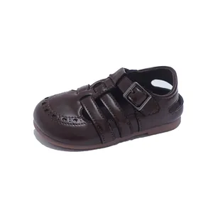 Vintage hollow-out brown leather sandals for toddlers with buckle strap