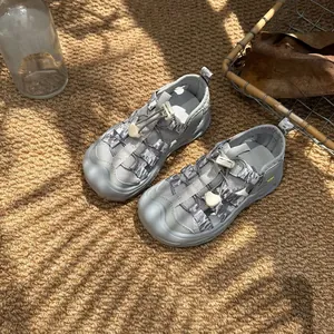 Detail of grey children's breathable mesh sandals with closed-toe anti-slip design