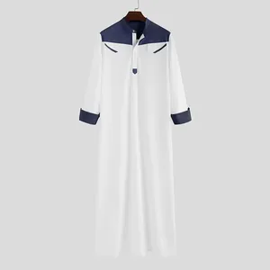 Loose men's white long robe jubba with navy blue patchwork stand collar and cuffs