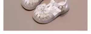 White sparkling girl's sandals with rhinestone butterfly bow detail and soft sole
