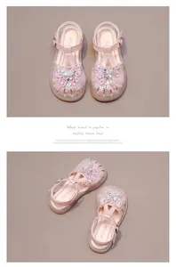 Detailed view of pink princess sandals with sparkling rhinestone butterfly design.