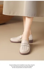 Detailed view of beige soft leather loafers with hollow star patterns and flat soles
