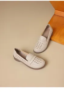 Beige laser-cut hollow loafers with comfortable soft flat sole for stylish casual wear