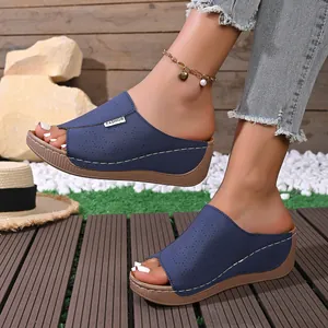 Stylish blue laser-cut wedge platform slippers for women with floral pattern details