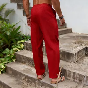 Back view of men's red cotton linen pants in a loose casual straight-leg fit.
