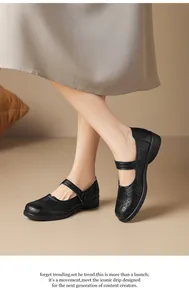 Close-up view of black retro hollow-out flat shoes with soft soles worn by a model outdoors