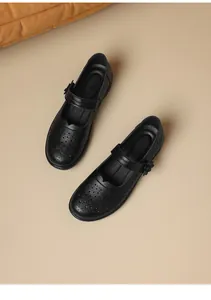 Detailed top view of black vintage hollow-out leather Mary Jane shoes for women