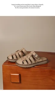 Detail view of retro beige women's slide sandals with buckle on a wooden surface