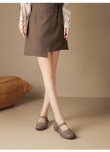Detailed view of elegant breathable laser-cut Mary Jane mother shoes for women in brown color