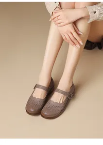 Detail view of retro hollow-out Mary Jane shoes with flower accent