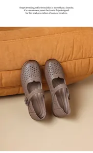 Elegant vintage brown perforated Mary Jane shoes with soft soles and floral buckle detail