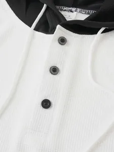 Close-up of men's waffle knit hooded T-shirt with black button placket detail