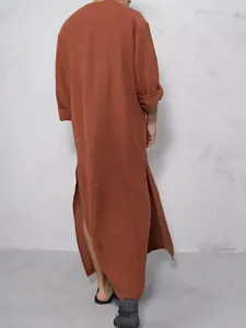 Rear view of men's traditional terracotta long-sleeve robe with relaxed side slits