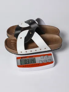 Detailed view of women's cross-strap rivet sandals weighing approximately 0.314 kg.
